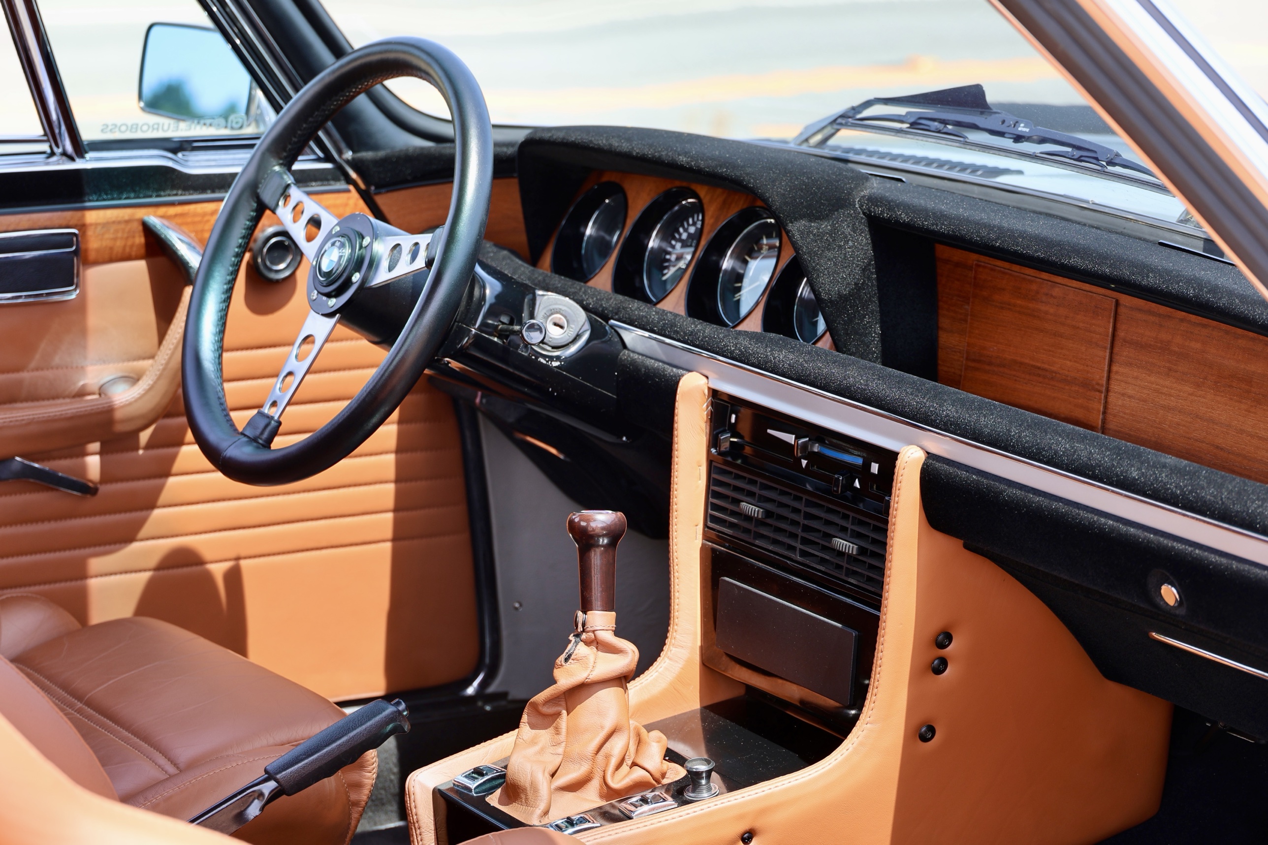 Interior dashboard, steering wheel, and shifter